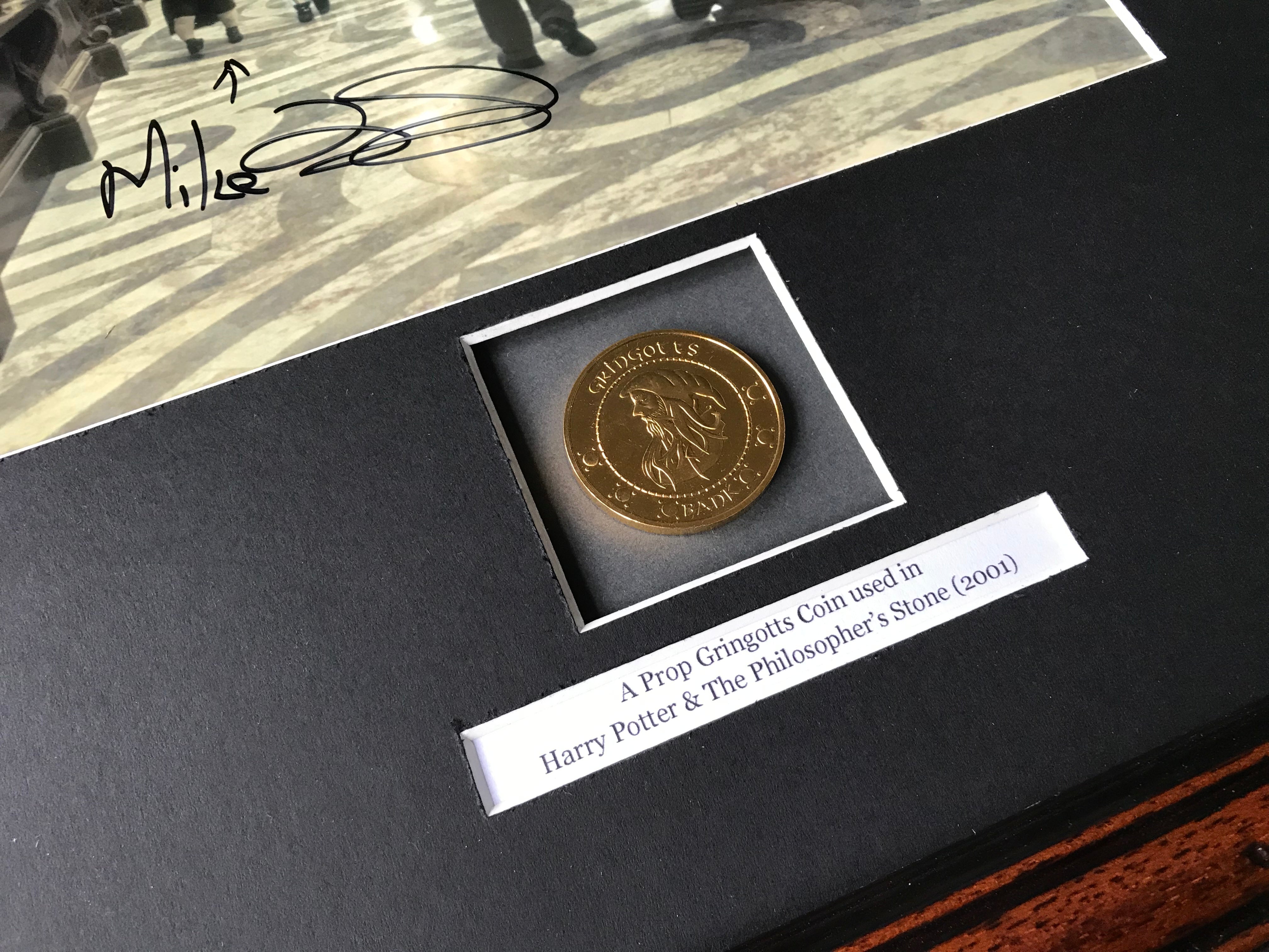Harry Potter & The Philosopher’s Stone - A Prop Gringotts Coin inside an Autographed Display
